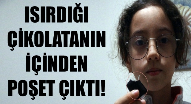 Isırdığı çikolatanın içinden poşet çıktı!