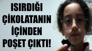 Isırdığı çikolatanın içinden poşet çıktı!